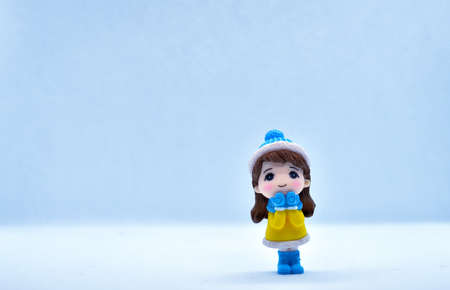 Tourism and travel concept: Miniature little girl standing in isolated backgroundの写真素材
