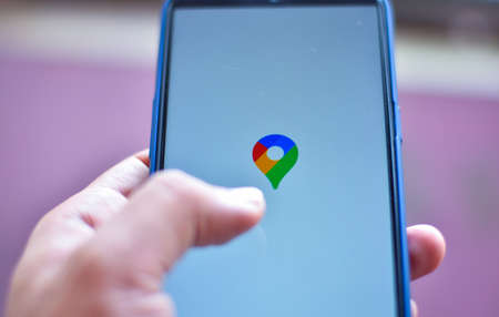 mobility and modern lifestyle concept: human checking to start map for navigationの写真素材