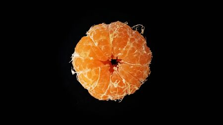 Orange fruit isolated on a black background with more freshnessの写真素材