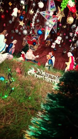 Christmas banner. Background Xmas design of sparkling lights, garland, with realistic gifts box, black snowflake and glitter gold confetti. Horizontal Christmas poster, greeting cards, headers, websitの写真素材