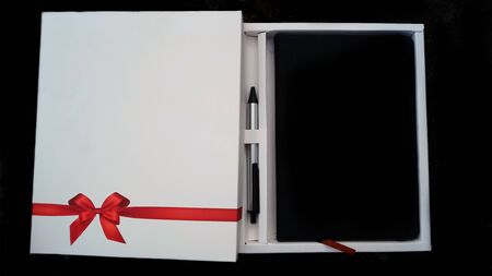 Beautiful diary gifting with wonderful red ribbon design and penの写真素材