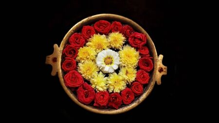 Indian flower decoration in holy water. It's a Hindu religion to pray to the god with the beautiful flower decorationの写真素材