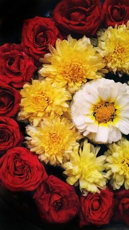 Indian flower decoration in holy water. It's a Hindu religion to pray to the god with the beautiful flower decorationの写真素材