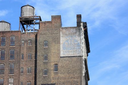 Old brick building with water towerの写真素材
