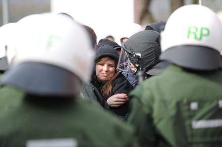 Zweibruecken, Germany - March 20, 2009: Protests against Neo Nazis and right wing extremists. Police guards counter-demonstratorsのeditorial素材
