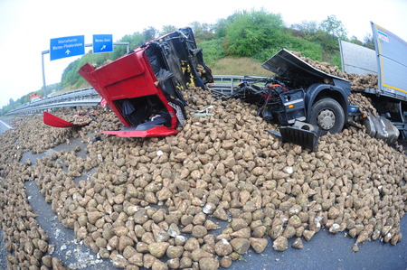 Worms, Germany - September 16, 2009 - Truck crash on german highway A61 near Worms, destroyed by its loaded turnips, no people have been hurt.のeditorial素材