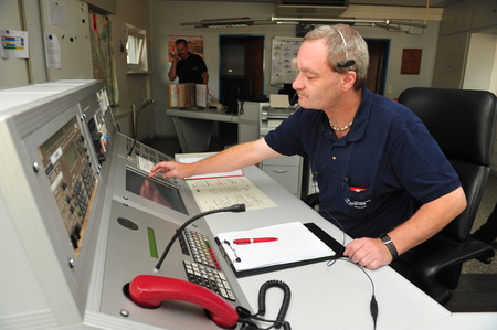 Worms, Germany - Jule 21, 2009 - Fire fighter in control room of fire department Worms taking an...