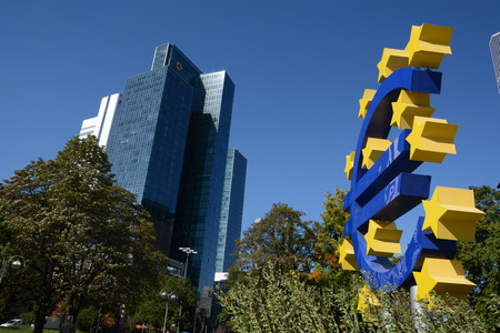 Frankfurt, Germany - October 1, 2015 - Euro symbol with bank institute Commerzbank in background