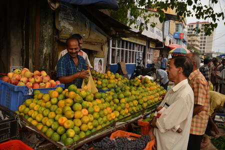 Mumbai, India - November 6, 2015 - Vegetable traders on indian crawford market bargaining with clientsのeditorial素材