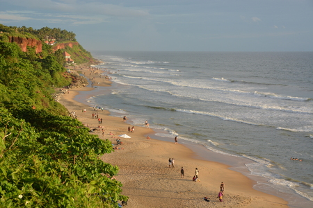 Varkala, India - November 2, 2015 - Pilgrims on Varkala beach, a holy place for hindusのeditorial素材