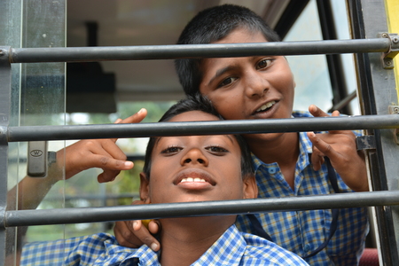 Mumbai, India - October 28, 2015 - Children from childrens home driving in school bus powered by chartiy project based in Europeのeditorial素材
