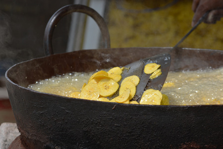 Frying banana chips in Kochi, Kerala, South Indiaの写真素材