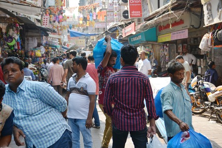 Mangalore, India - October 19, 2015 - Crowded market road in Mumbai with carriersのeditorial素材
