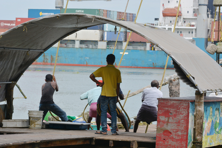 Kochin, India - November 1, 2015 - Harbor of Kochin, South India with traditional fishers and shipsのeditorial素材