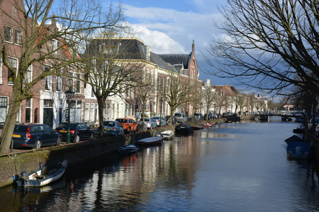 Alkmaar, Netherlands - March 27, 2016: Beautiful canal in Alkmaar with blue skyのeditorial素材