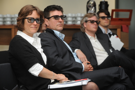 Berlin, Germany- May 26, 2009 - Business woman with 3d glasses listening on trade show and conference in Berlinのeditorial素材