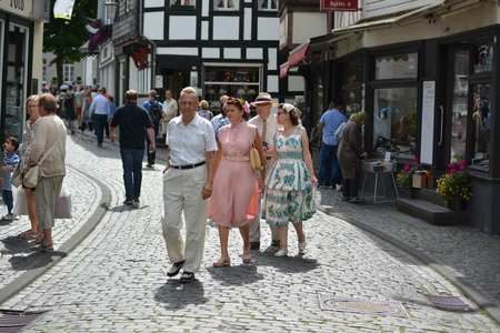 Monschau, Germany - July 22, 2017: People in old-fashioned clothing walking through Monschauのeditorial素材