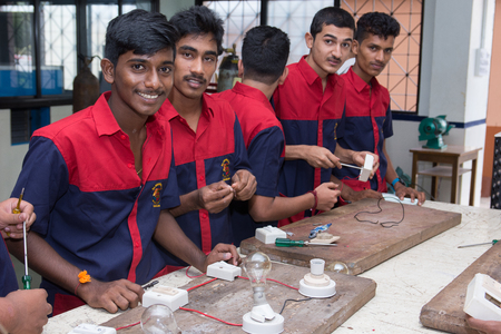 Mumbai, India - July 8, 2018 - Indian boys learning about electricity in vocational schoolのeditorial素材
