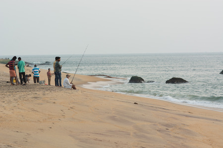 Goa, India - July 8, 2018 - Indian locals fishing on Om Beach near Gokarna - Indiaのeditorial素材