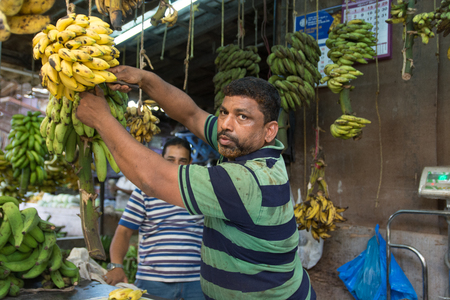 Mumbai, India - July 8, 2018 - Vendors on market selling bananasのeditorial素材