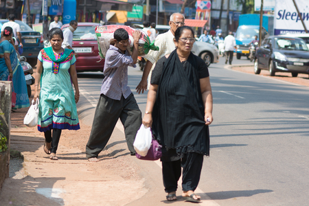 Goa, India - July 8, 2018 - Women on indian street in Canacona - Goaのeditorial素材