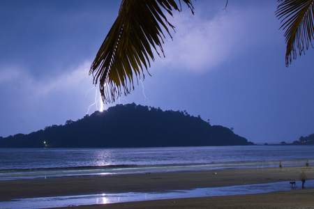 Goa, India - July 8, 2018 - Tropical thunderstorm on beach of goa
