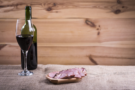 wine and plate of sausagesの写真素材