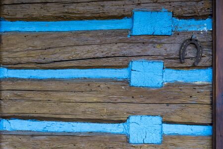 horseshoe nailed to the wall of the house "fortunately"の写真素材