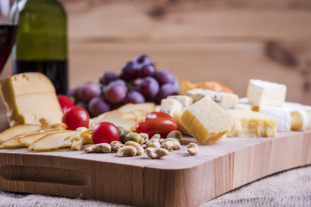 cheese platter and wine - a light snackの写真素材