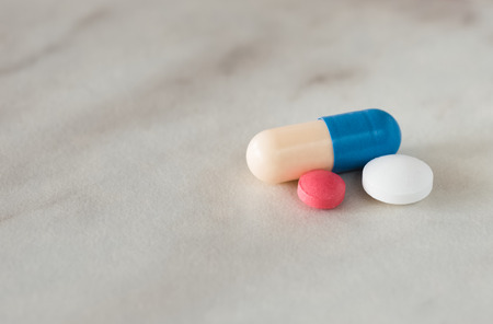 electrocardiogram and pills in backgroundの写真素材