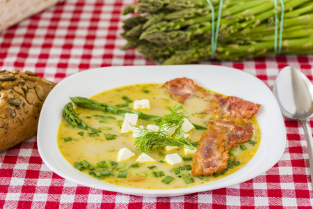 Asparagus soup with feta cheese and baconの写真素材