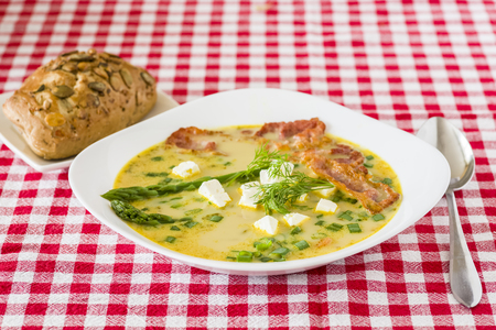Asparagus soup with feta cheese and baconの写真素材