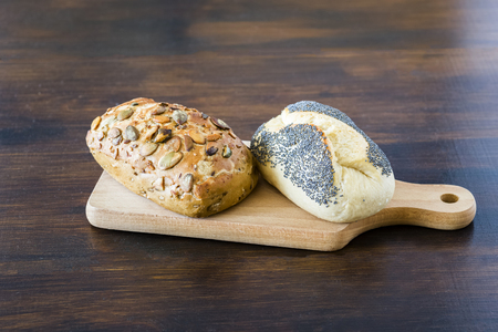 Buns with different grains, sesame, poppy seeds, pumpkin seedsの写真素材