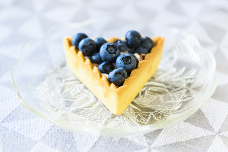 cakes with cream and blueberries