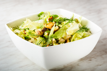 Salad with chicken, avocado and croutonsの写真素材