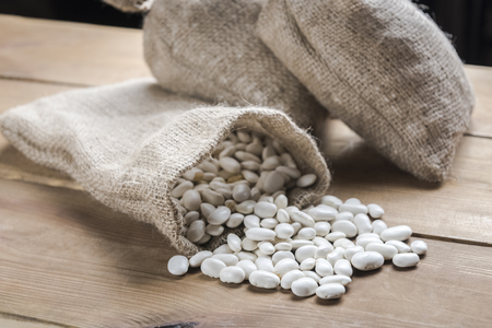beans scattered on the kitchen tableの写真素材