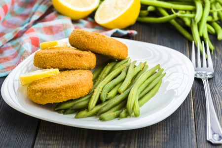 Fish burgers served with green bean sproutsの写真素材