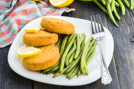 Fish burgers served with green bean sproutsの写真素材