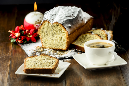 Christmas cake with poppy seed and hot coffeeの写真素材