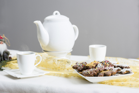 Christmas table and a plate of cookiesの写真素材