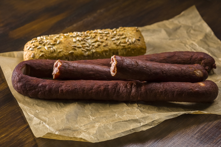 smoked sausage and spicy salami - a photo in a rustic styleの写真素材