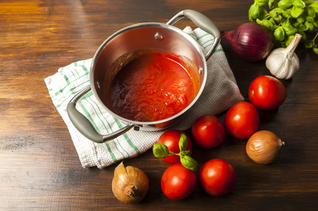 tomato sauce is an inseparable component of many dishes - the basis of Italian cuisineの写真素材