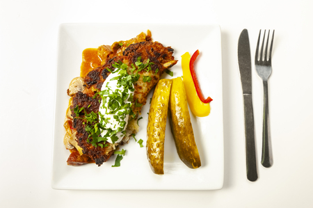 potato pie served with pork stew with mushroomsの写真素材