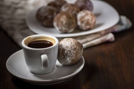 mini cheese donuts on a white plate - dark food style photoの写真素材