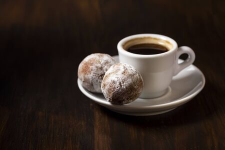 mini cheese donuts on a white plate - dark food style photoの写真素材