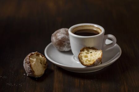 mini cheese donuts on a white plate - dark food style photoの写真素材