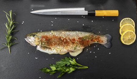 Preparing fish for the holidays - grilled troutの写真素材