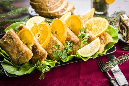 Carp - Christmas fish in Polish cuisine - served in orangesの写真素材