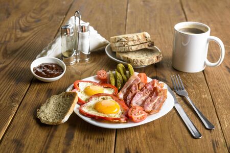 a simple sandwich with bacon on a white plateの写真素材