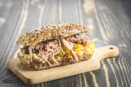 sandwich with pulled pork and sauerkraut - variants with different breads